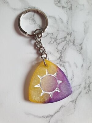 Porte clé médiator jaune violet soleil