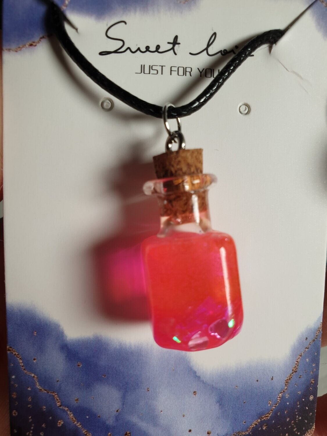 Collier potion magique fuschia