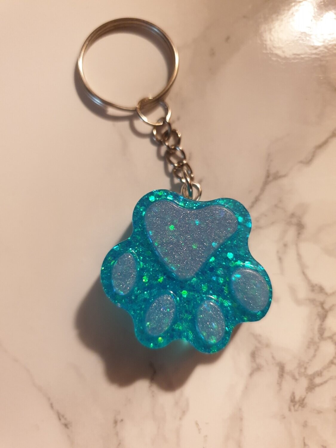 Porte de clé Patte bleu pailleté et rose