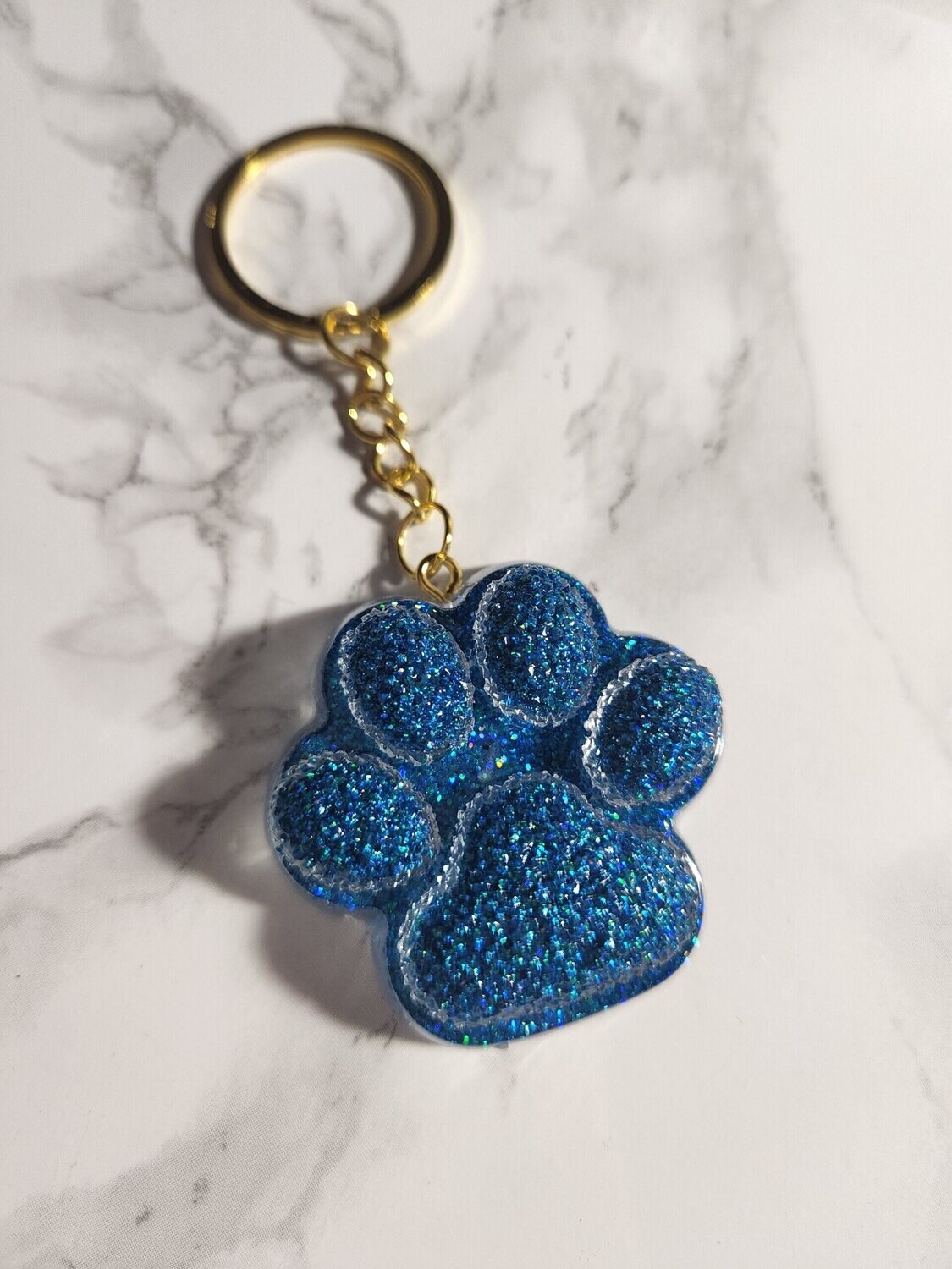 Porte de clé Patte bleue pailleté effet cristaux