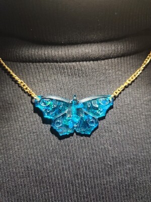 Collier papillon bleu pailleté chainette dorée