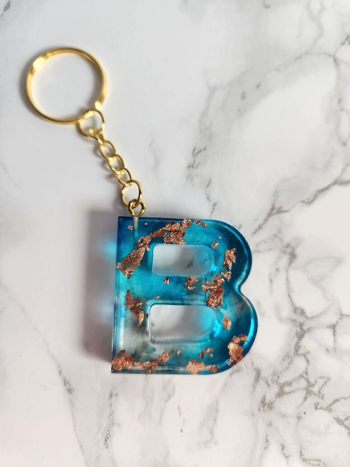 B bleu feuilles de bronze