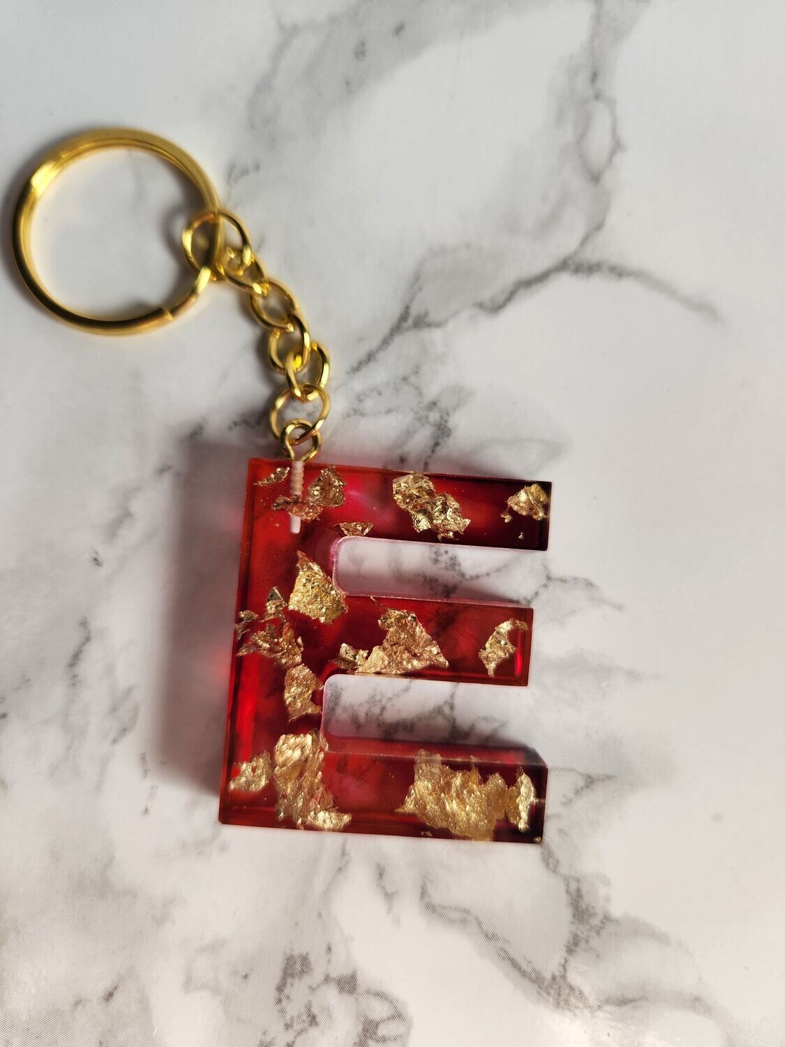 E rouge feuilles d'or