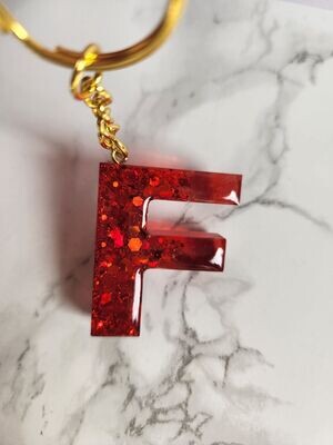 F rouge pailleté