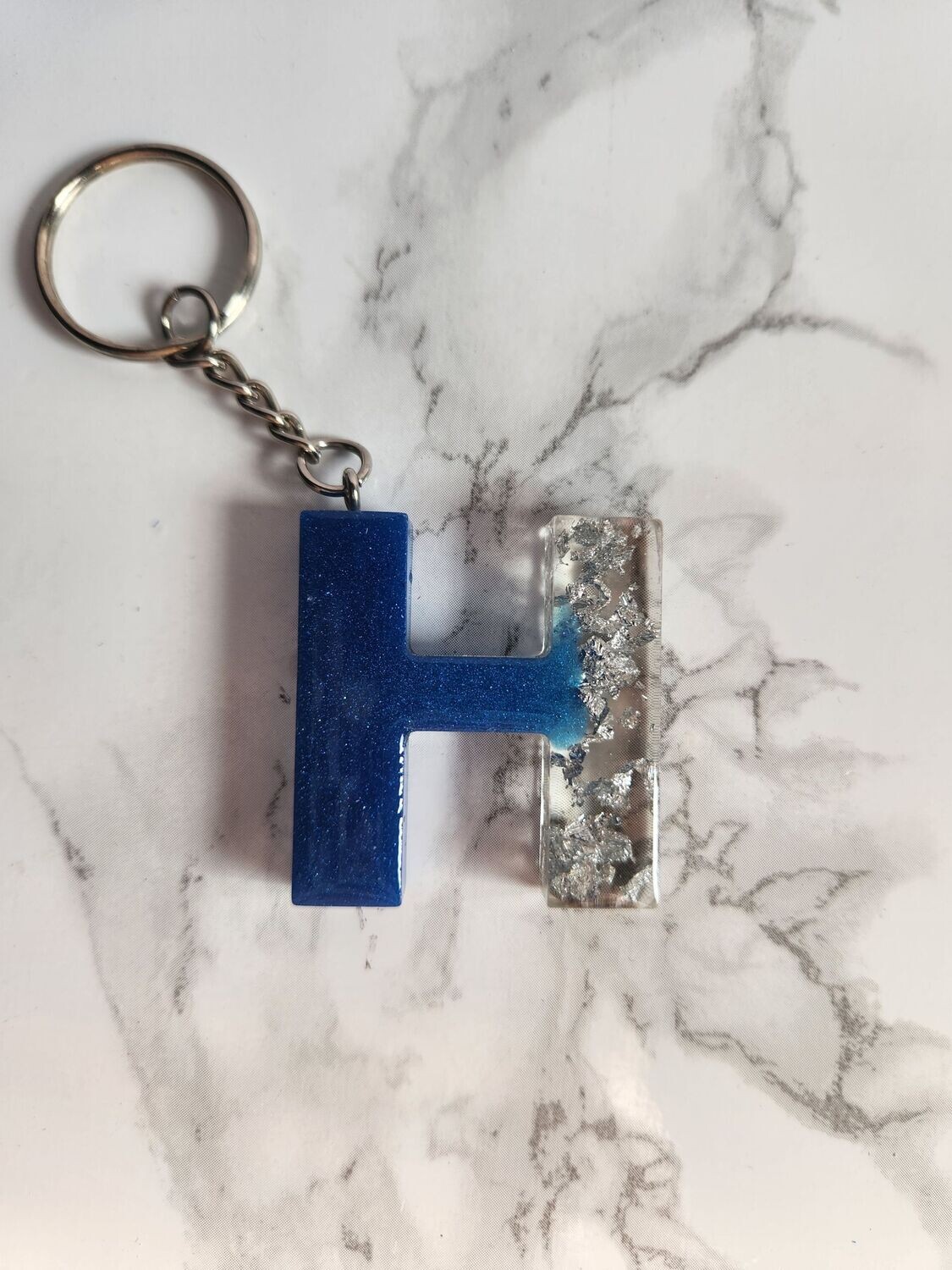 H bleu feuilles d'argent