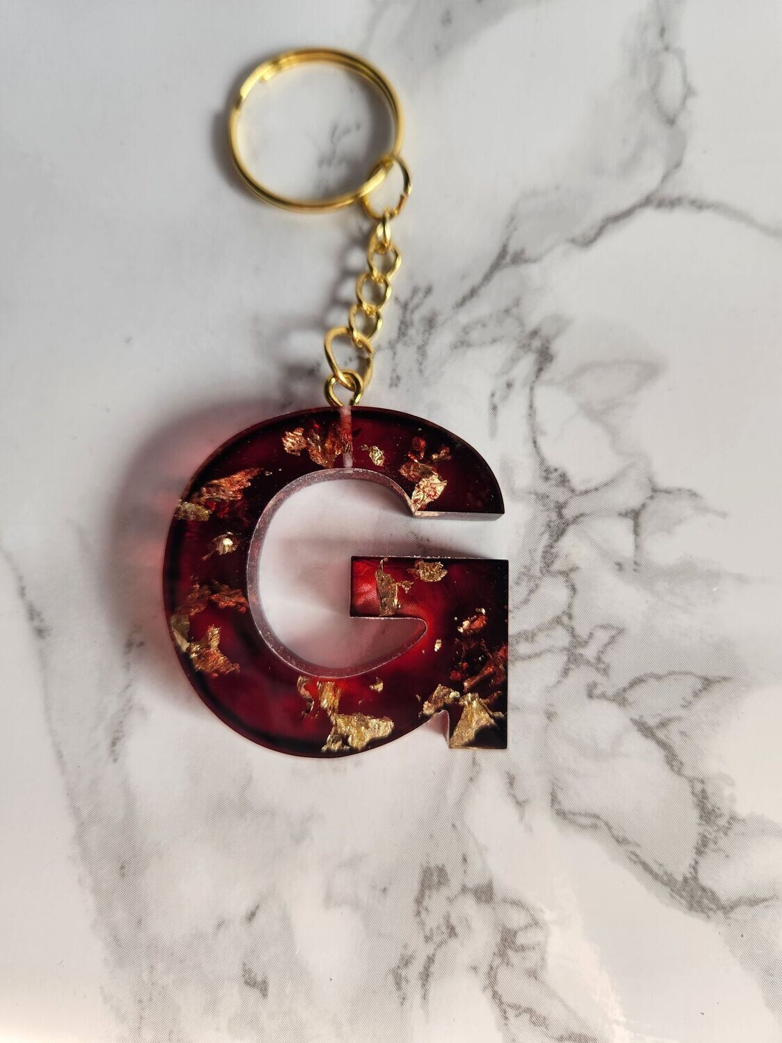 G rouge foncé feuilles d'or
