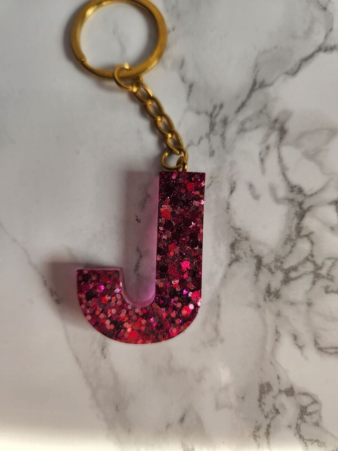 J rose foncé pailleté