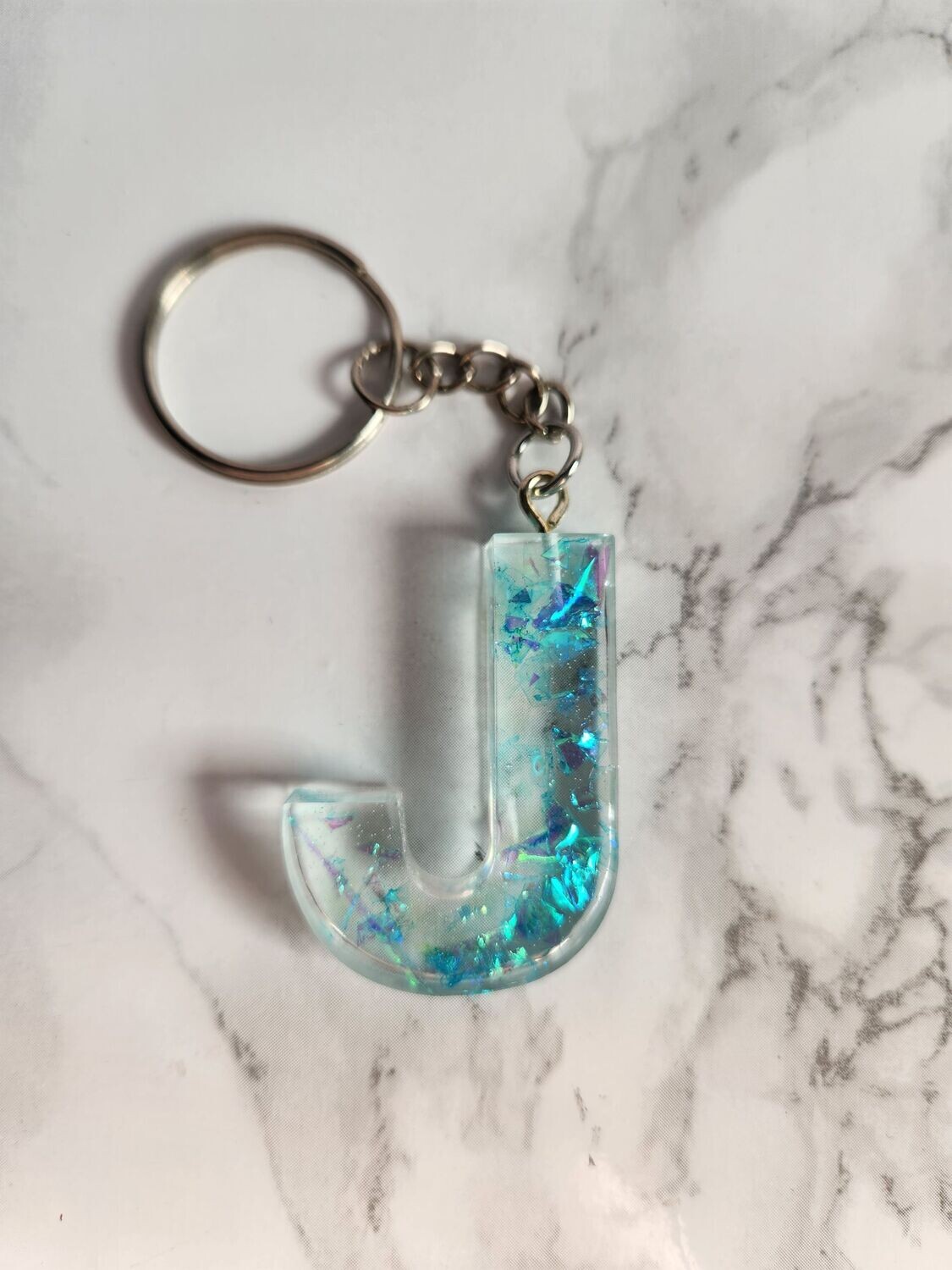 J confettis bleus holographiques