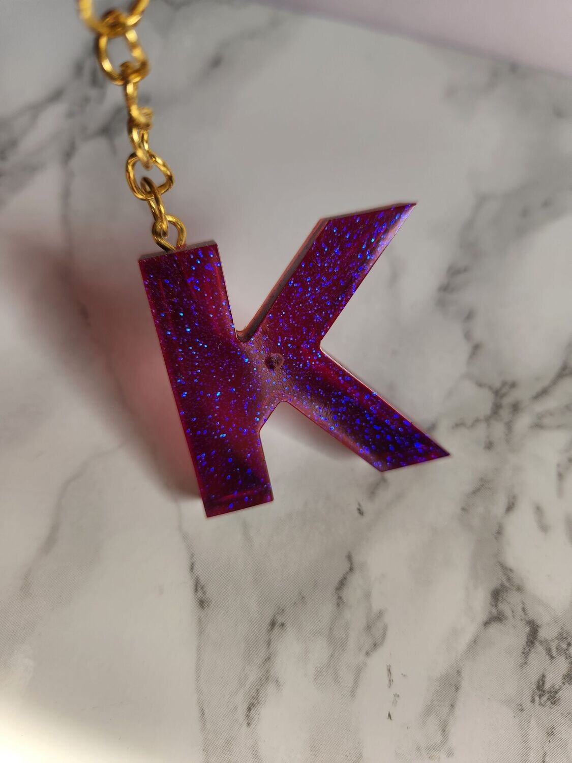 K violet paillettes bleues
