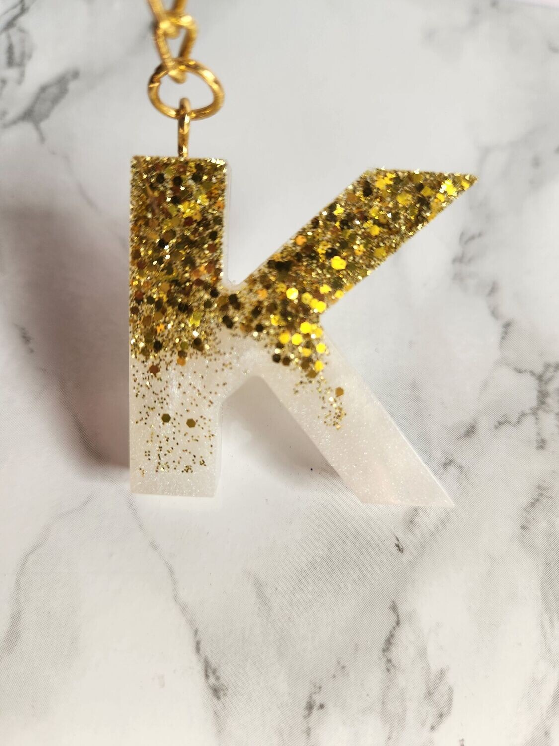 K blanc paillettes dorées