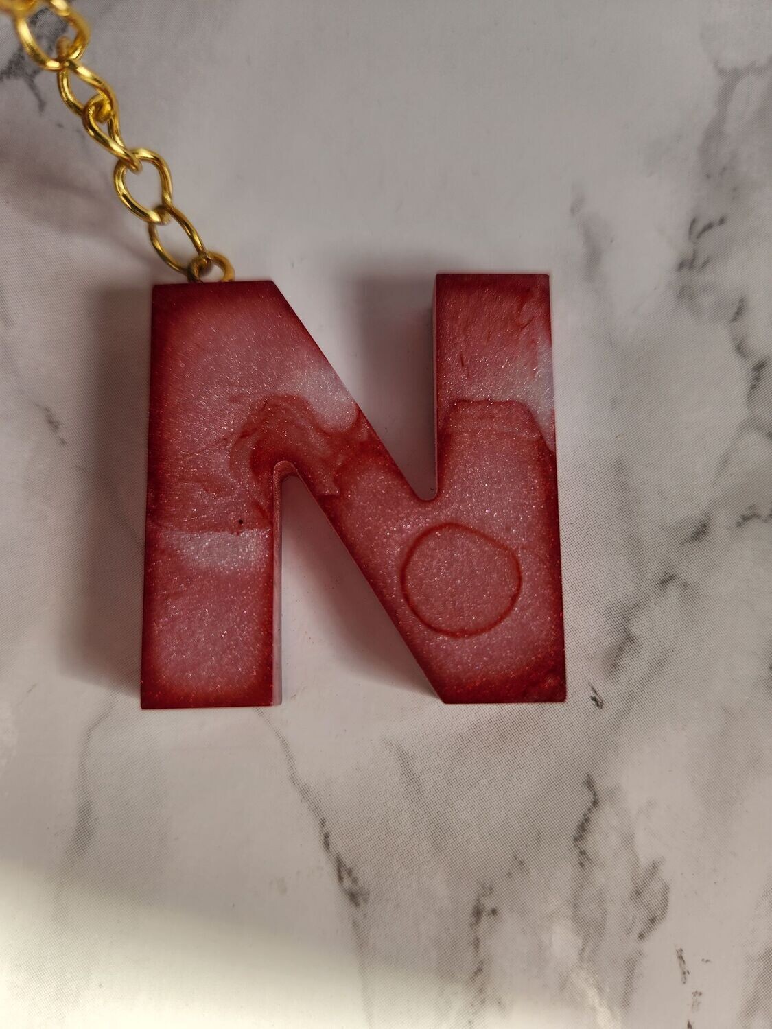 N marbré rouge et blanc