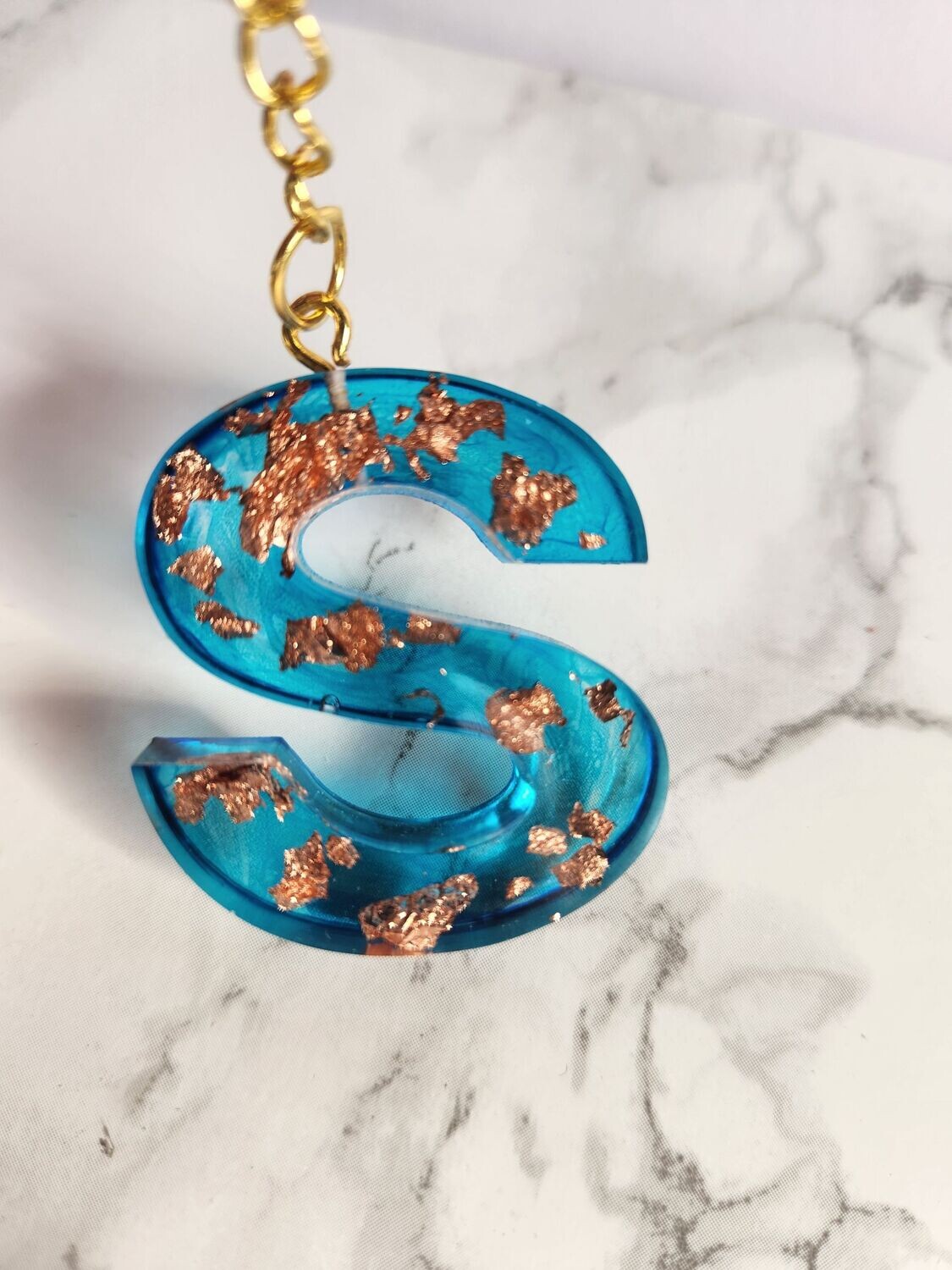 S turquoise feuilles de bronze