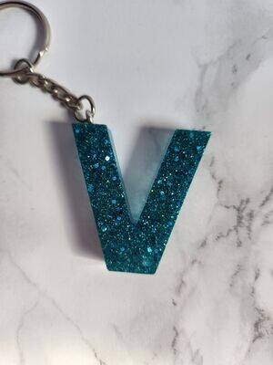 V turquoise pailleté