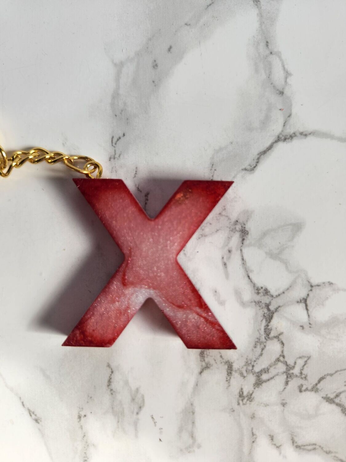 X marbré rouge et blanc