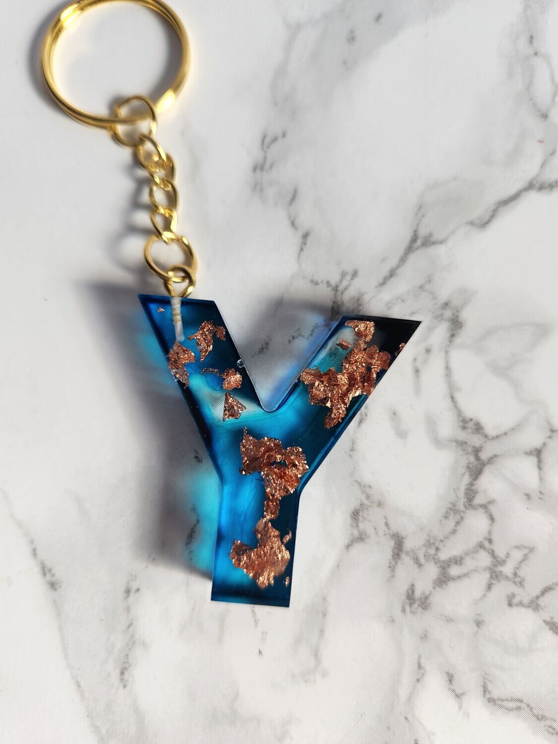 Y bleu feuilles de bronze