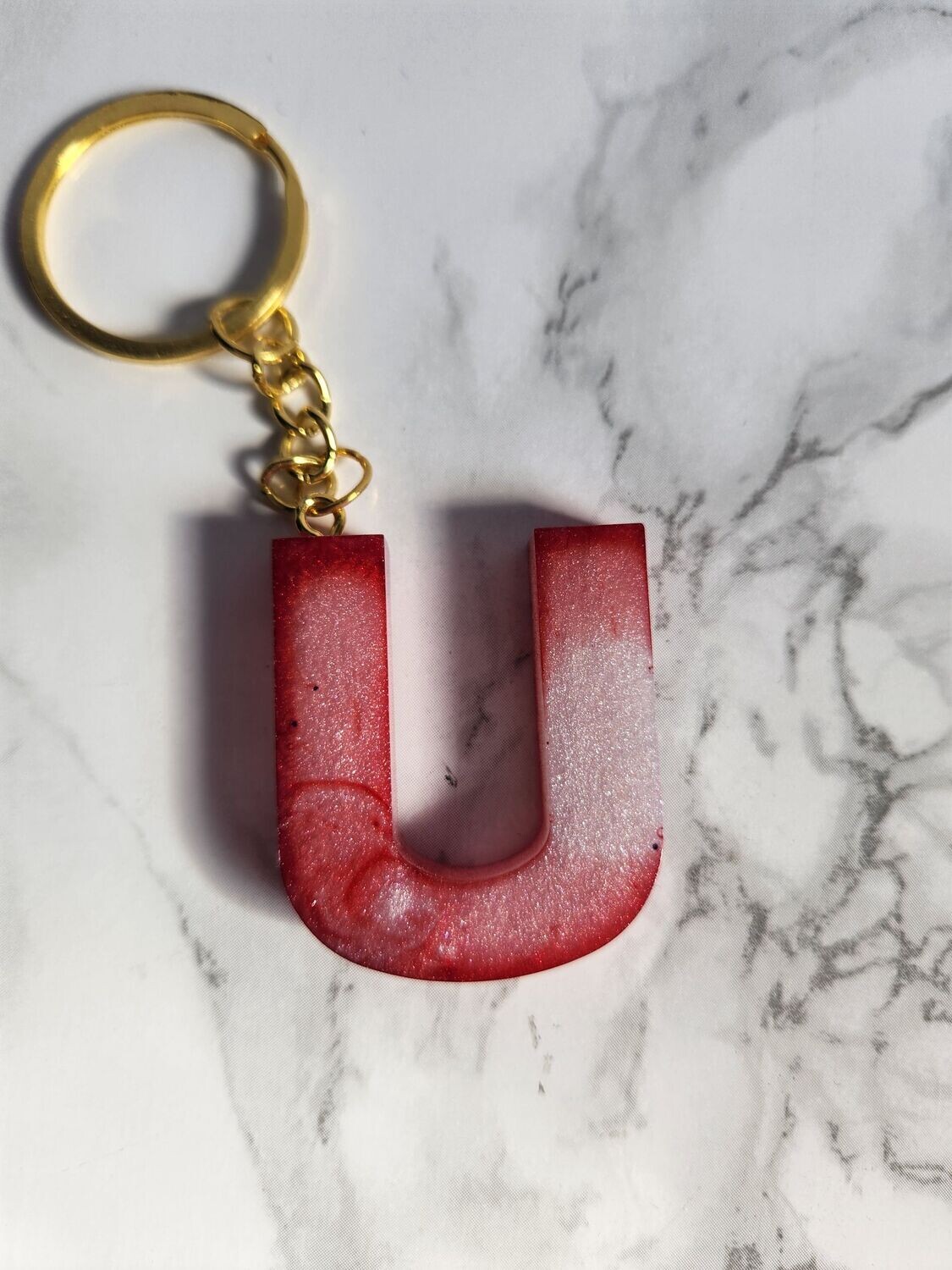 U marbré rouge et blanc