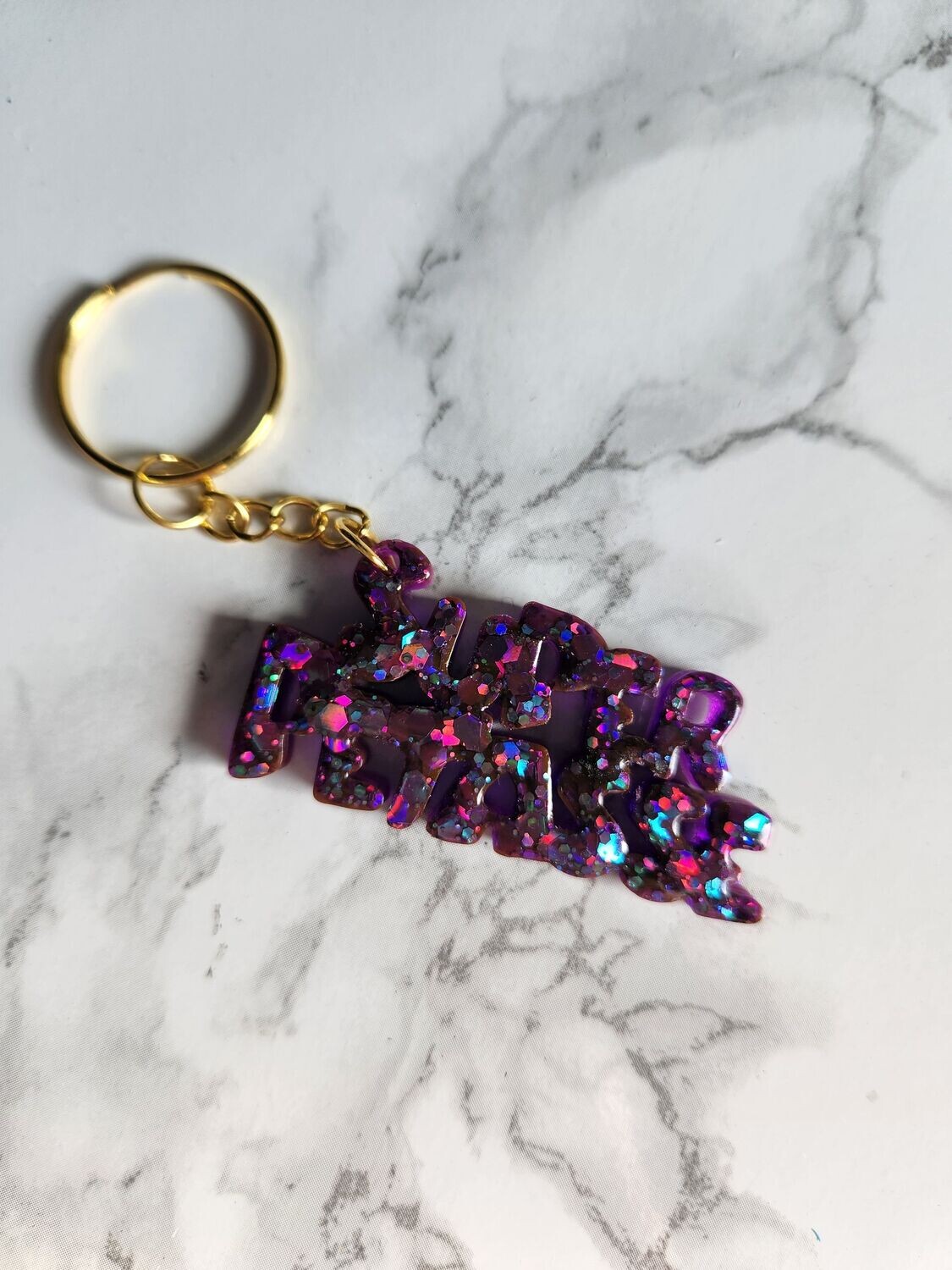 Porte clé super pétasse pailleté violet