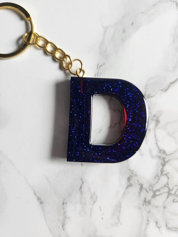 D bleu paillettes violettes