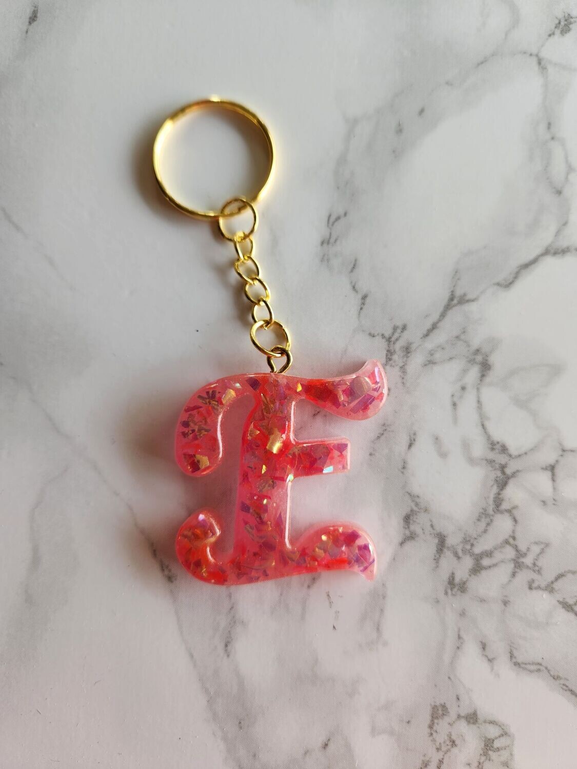 E script rose confettis dorés