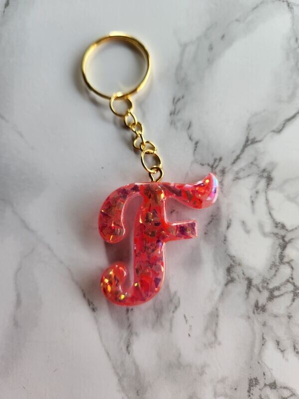 F script rose confettis dorés