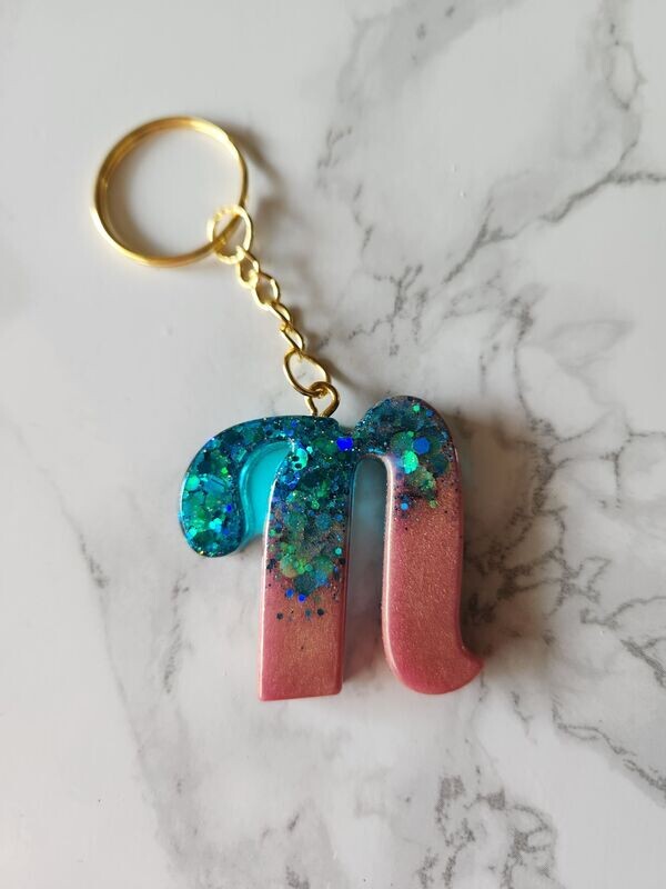 N script rose gold et paillettes turquoises