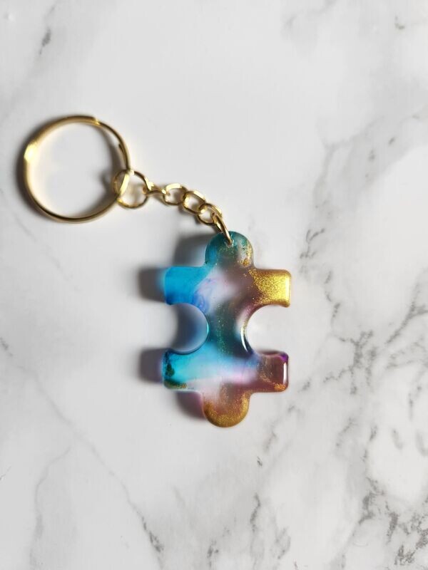 Porte clé puzzle bleu , rose et or