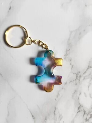 Porte clé puzzle bleu , rose et or