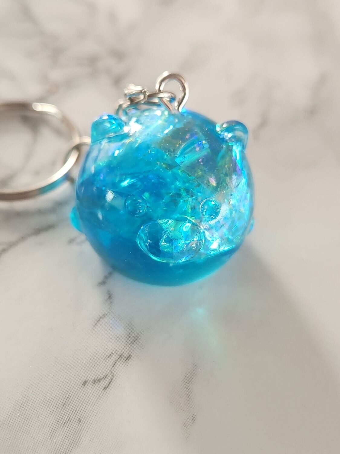 Porte clé Boule zanimo bleu holographique