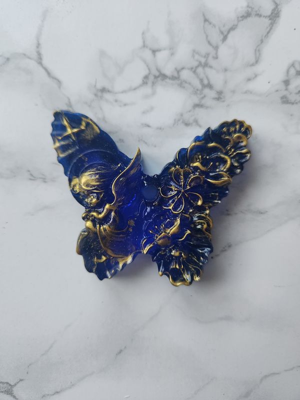 Ange papillon bleu et or translucide