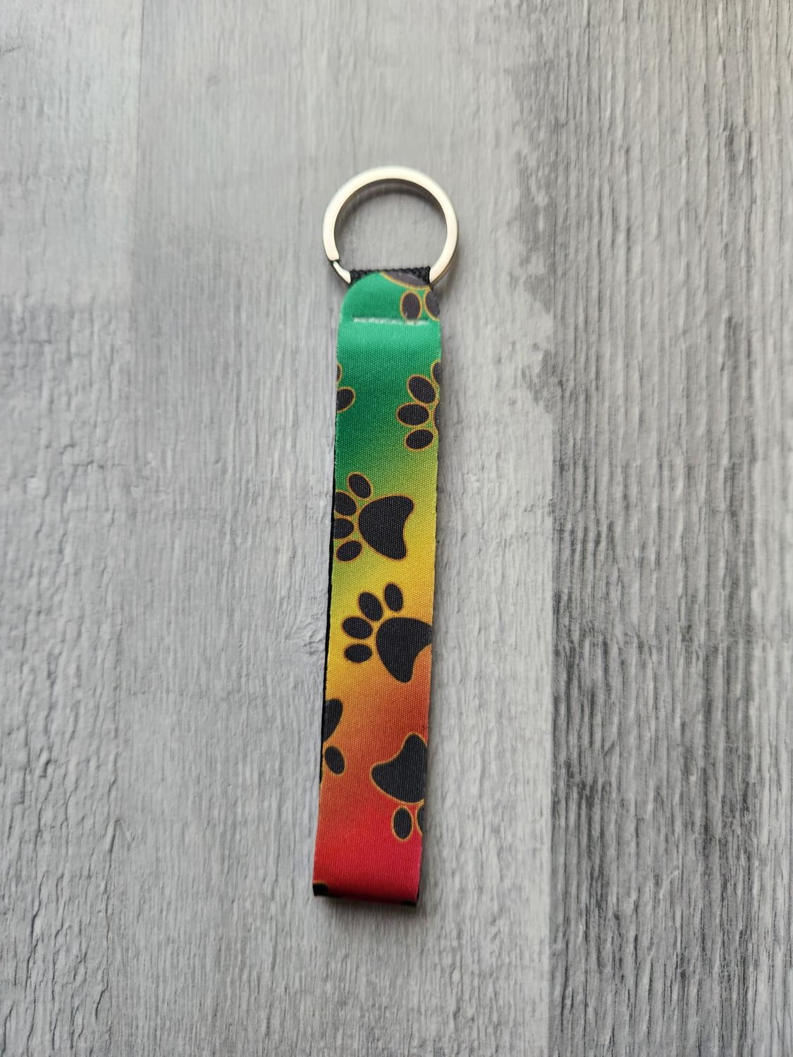 Porte clé lanière pattes de chien dégradé multicolore