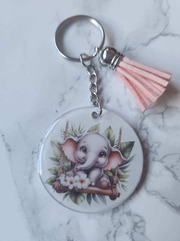 Porte clé éléphant sur sa balançoire