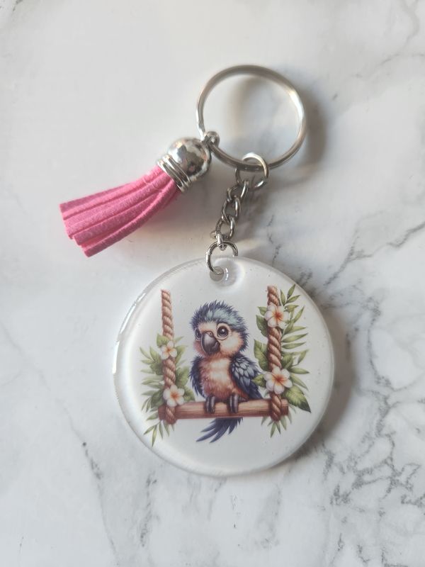 Porte clé perroquet sur sa balançoire