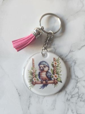 Porte clé perroquet sur sa balançoire