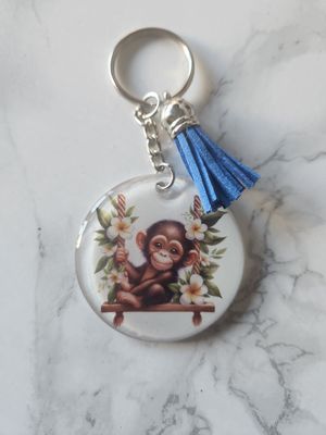 Porte clé singe sur sa balançoire Porte clé singe sur sa balançoire