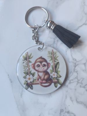Porte clé singe #2 sur sa balançoire Porte clé singe #2 sur sa balançoire
