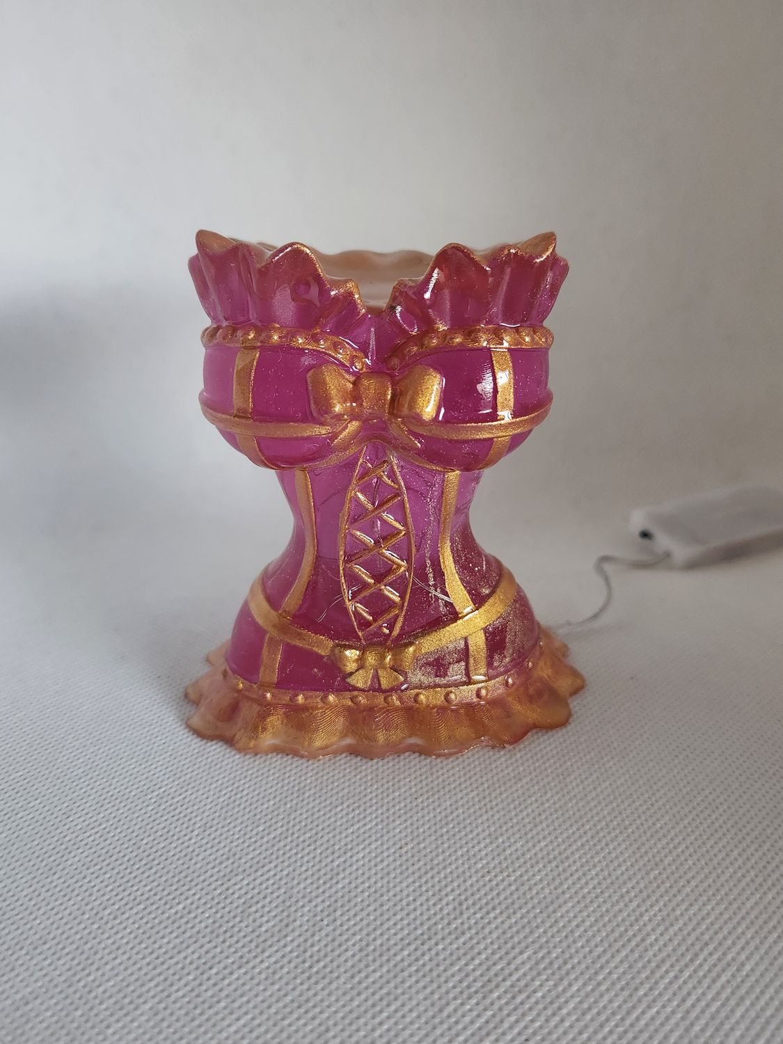 Corset rose et or translucide lumineux