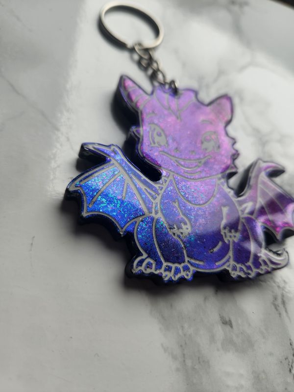 Porte clé dragon caméléon pailleté bleu violet vert