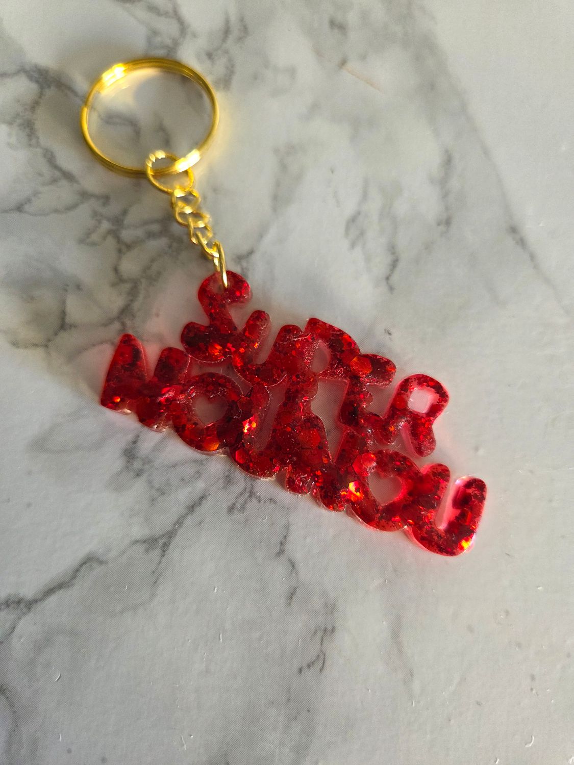 Porte clé super nounou rouge pailleté