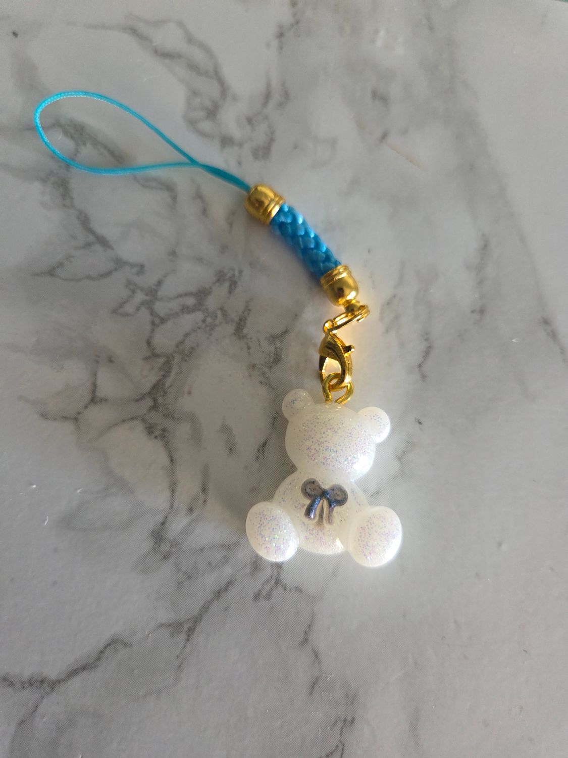 Bijou mini ourson noeud blanc strap bleu ciel