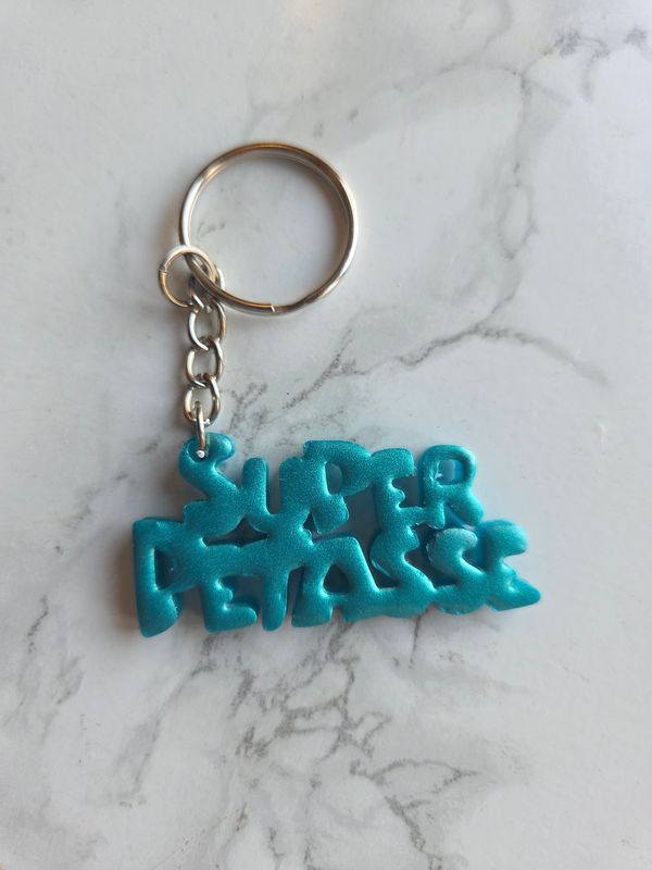 Porte clé super pétasse turquoise