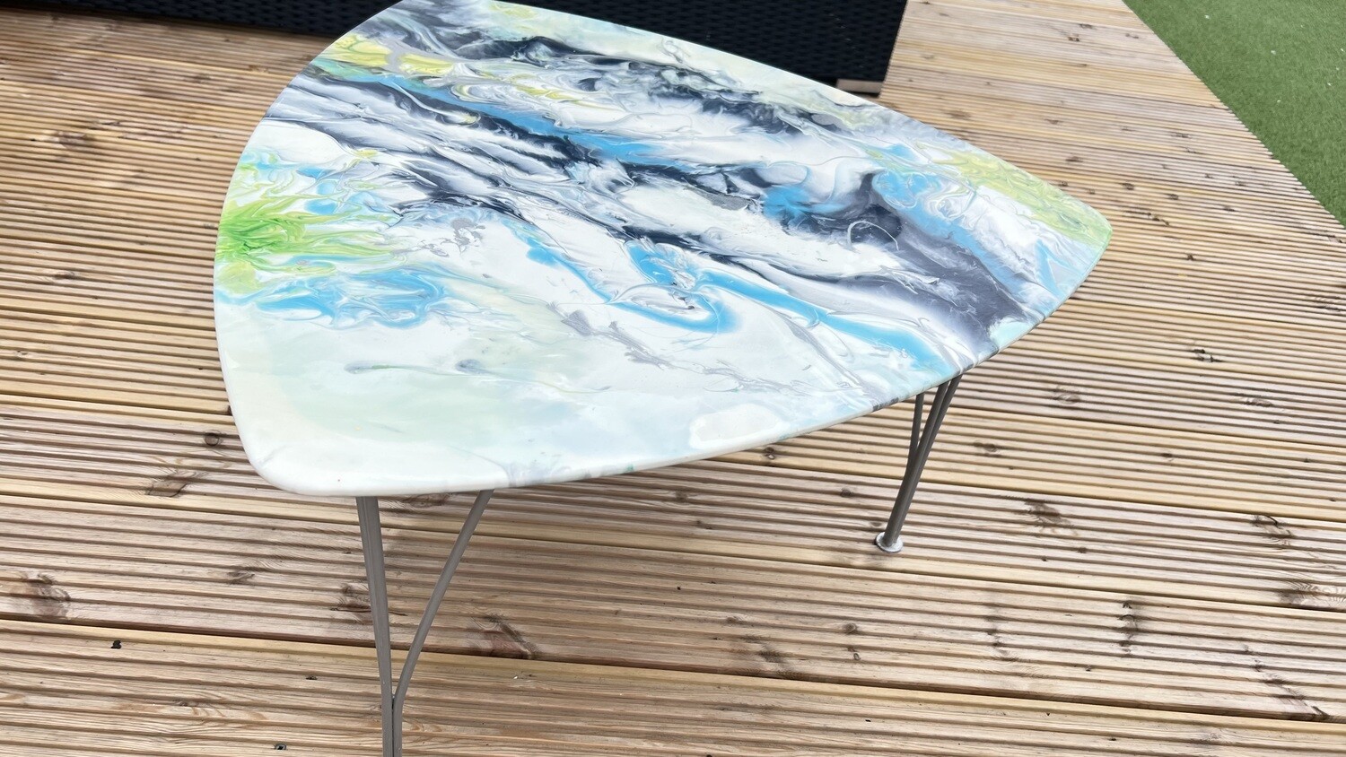 Upcycled resin topped triangle blue white and silver coffee table.