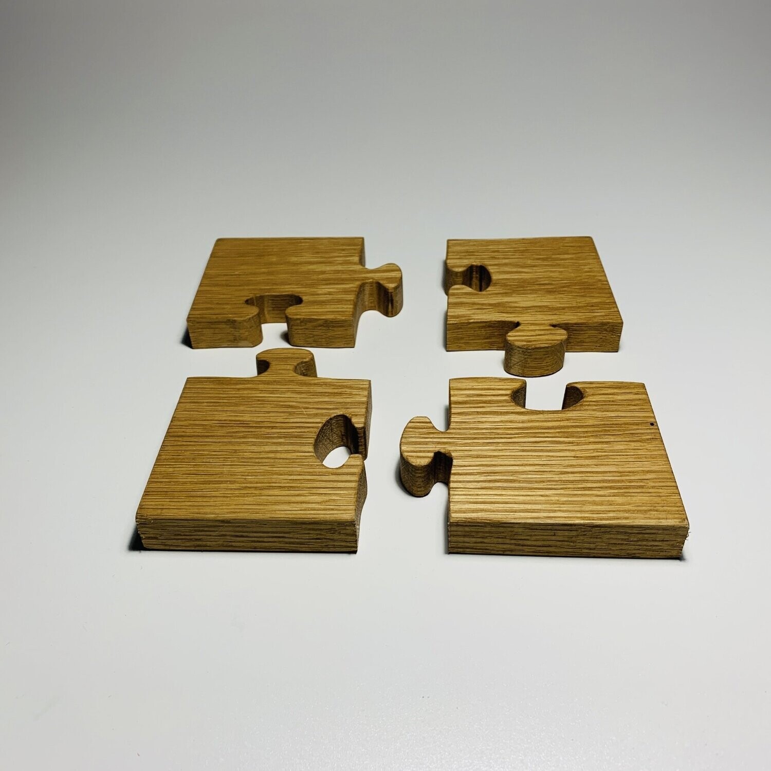 Jigsaw trivet and coasters in oak