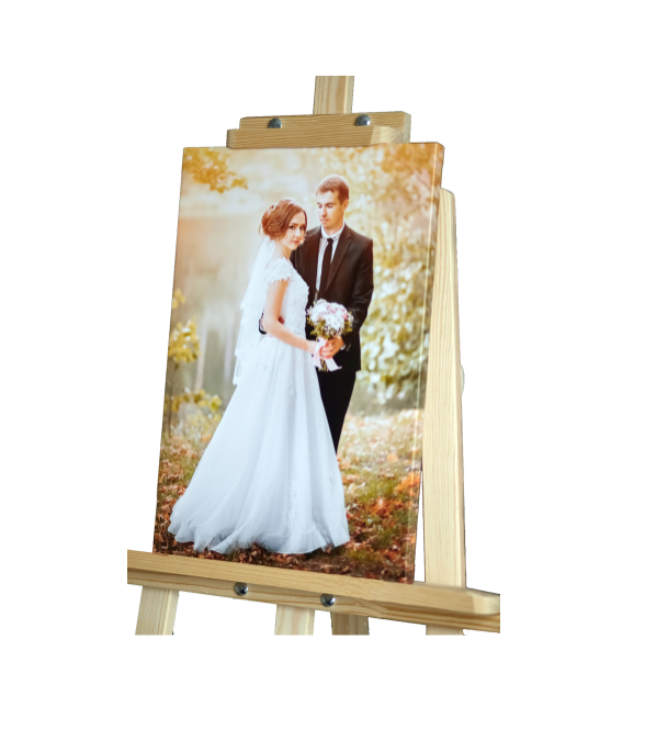 Custom printed canvas wedding photo, professionally stretched and mounted, displayed on a table top easel.