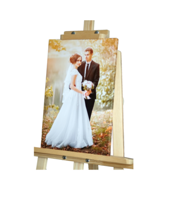 Custom printed canvas wedding photo, professionally stretched and mounted, displayed on a table top easel.