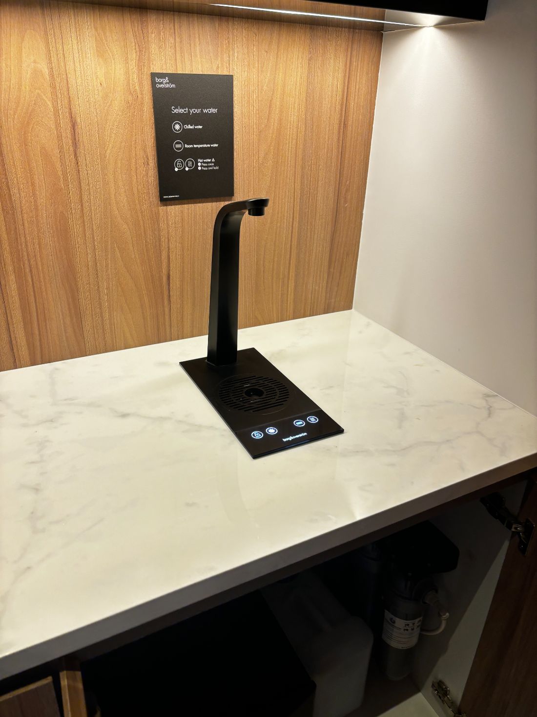 A Borg & Overström T3 tap installed on a marble counter at Sharjah Asset Management