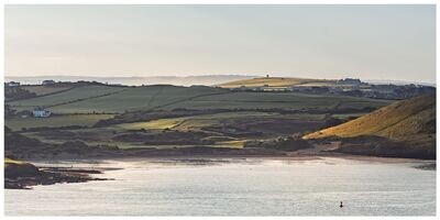 Panoramic photo of Cornish beach Daymer Bay and St Enodoc Church 