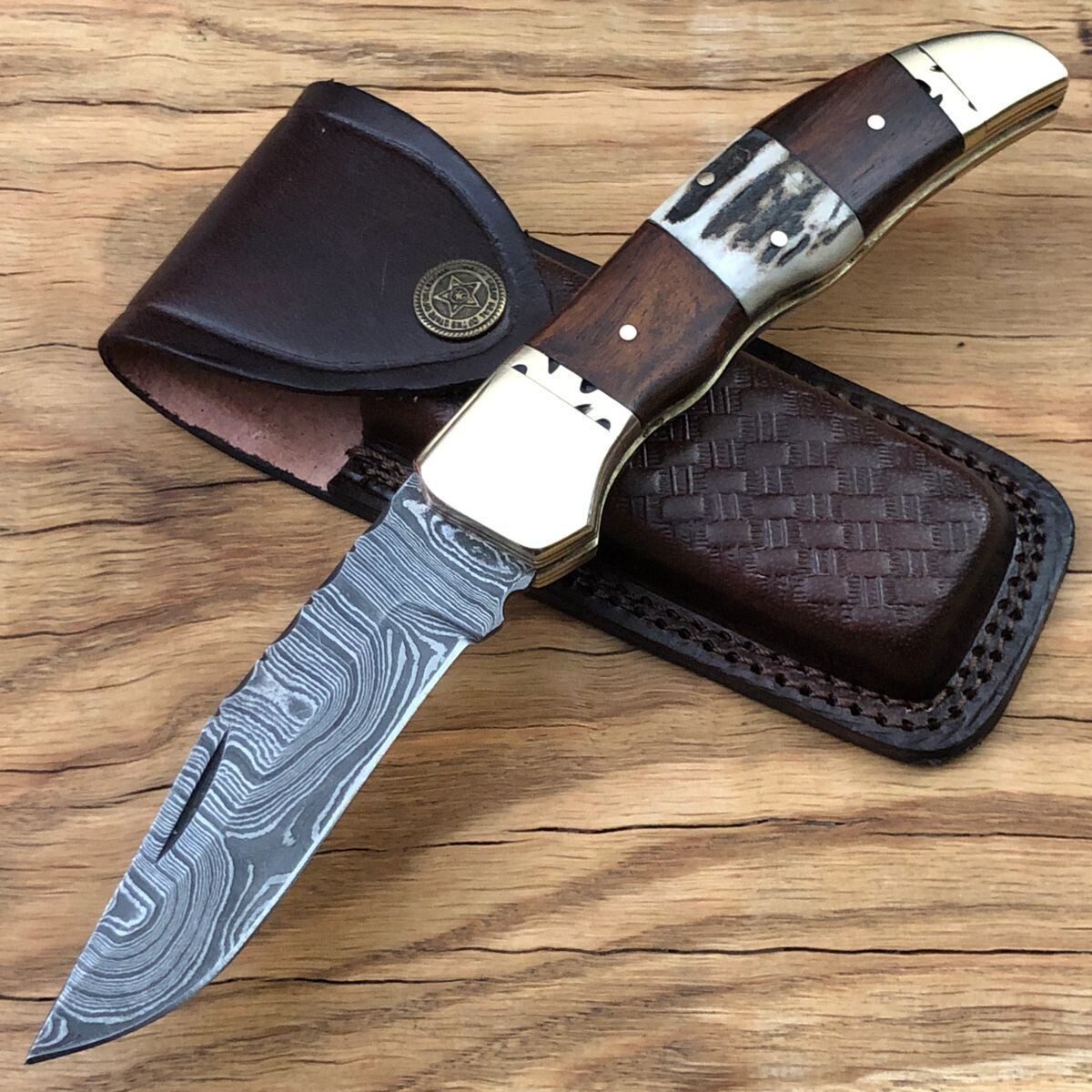 Damascus steel custom handmade pocket folding knife.