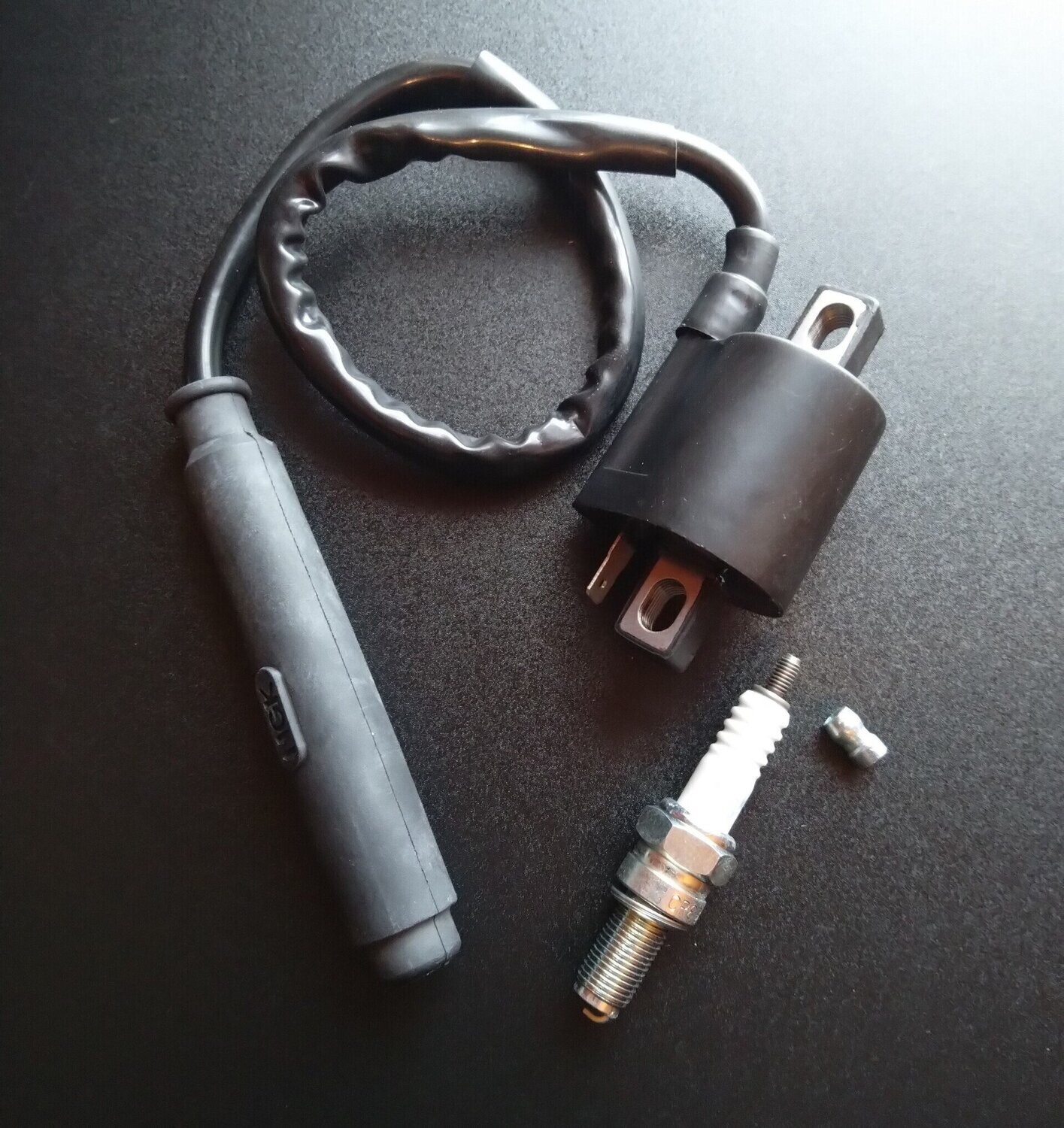 Kerzenstecker, Zündspule und Zündkerze