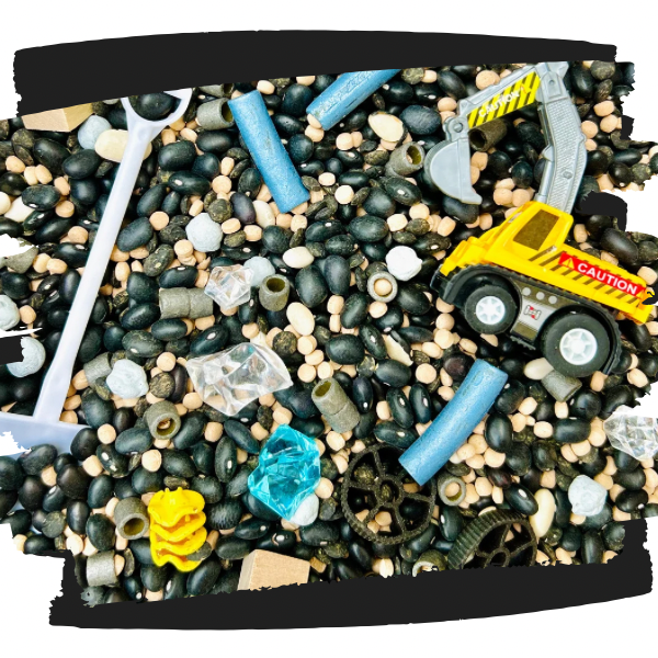 Construction truck themed sensory kit for sensory play with non-toxic dyed pasta and beans mixed sensory filler.
