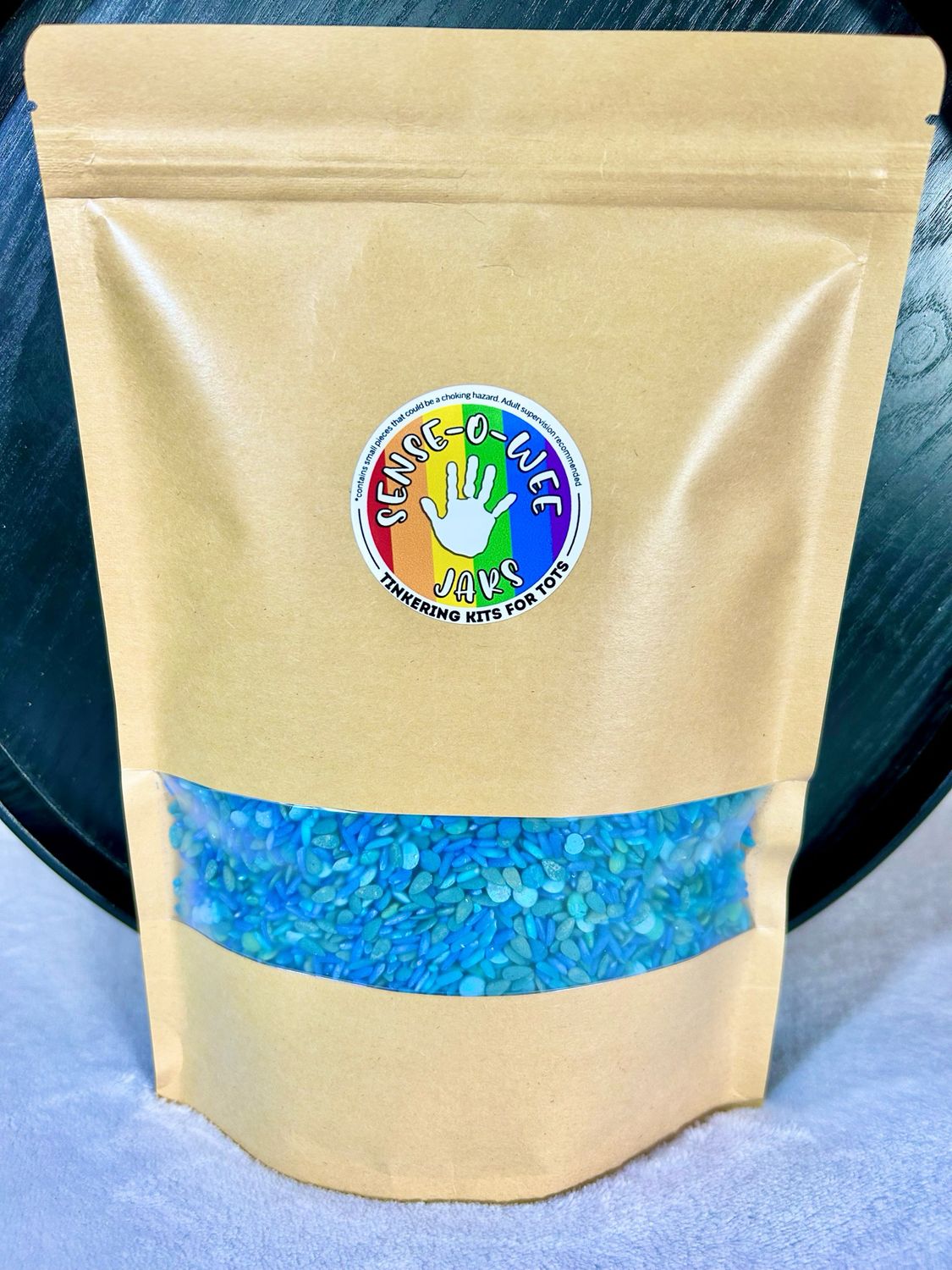 Sensory bin filler of non-toxic dyed rice, pasta and lentils for Ocean themed sensory play. Fills a Trofast bin for IKEA sensory table.
